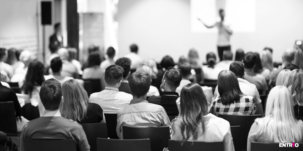 People sitting and listening on a conference