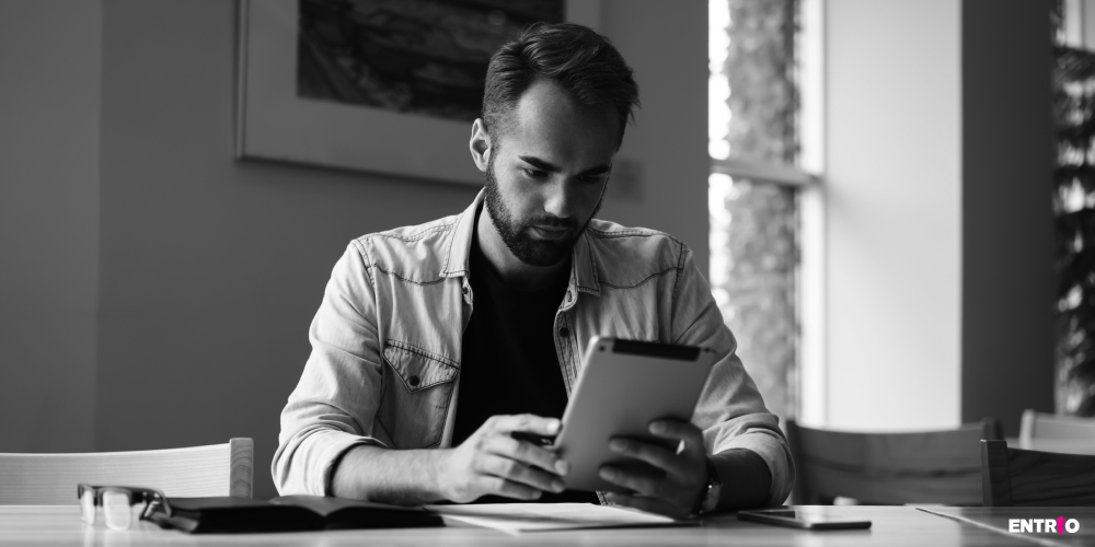 Man watching a virtual conference stream on his tablet