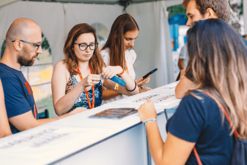 Visitors buying festival tickets at the Entrio checkpoint